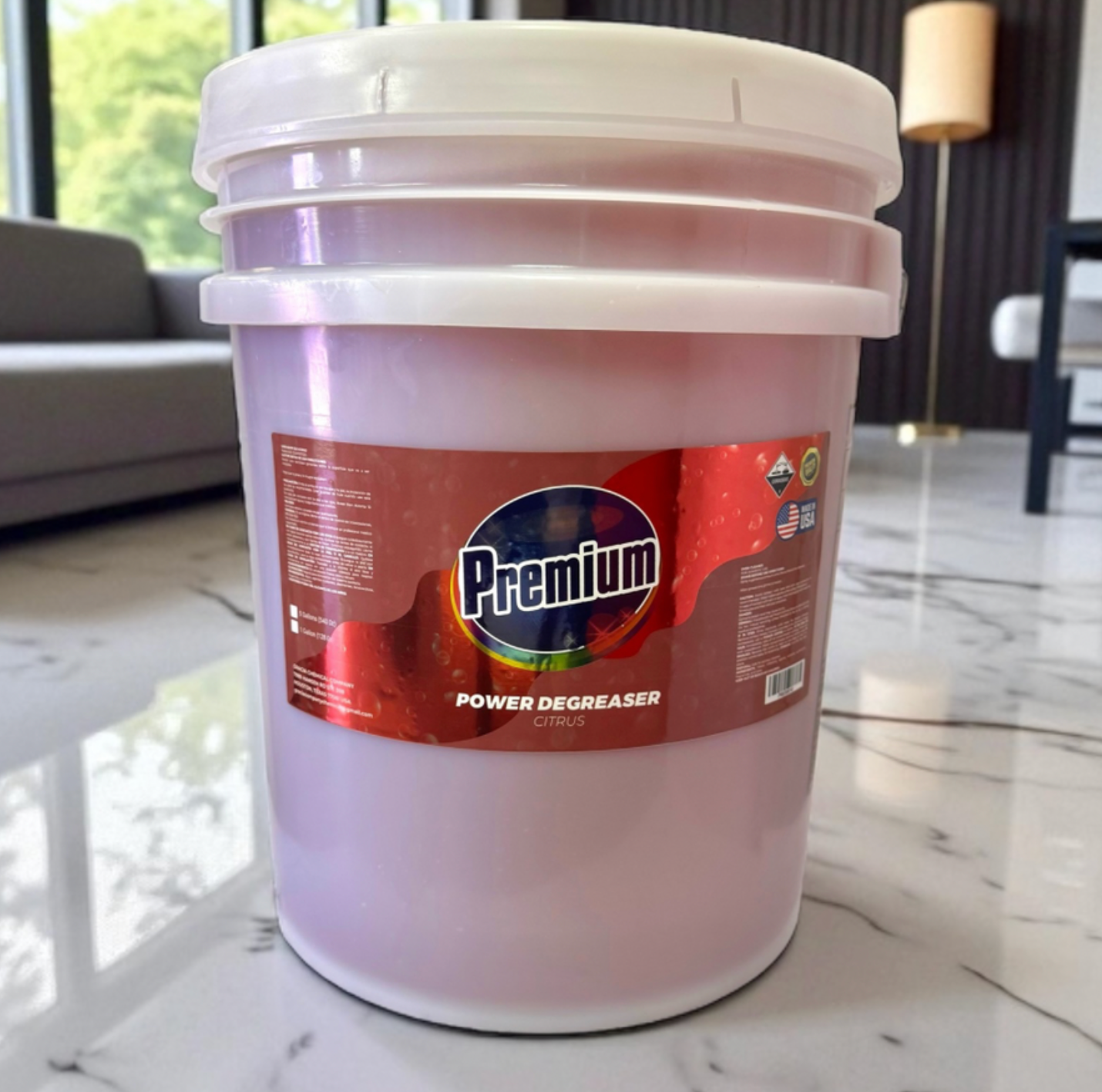 White bucket labeled 'Premium Power Degreaser' on a marble floor.